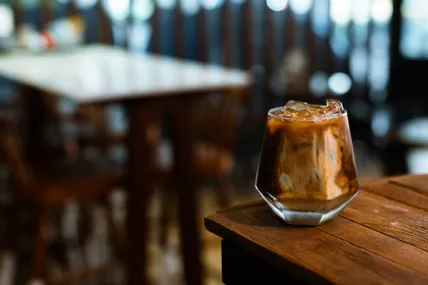 Iced coffee on a wooden table in a Brisbane cafe